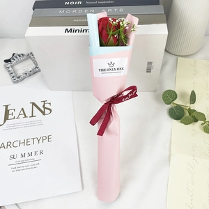 Detail of single red soap rose bouquet with pink wrapping and Just for you ribbon