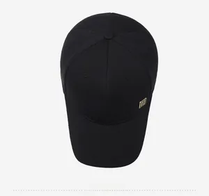 Top view of a black cotton baseball cap with a minimalist side emblem detail