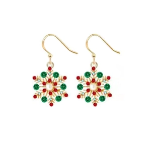 Detail of Christmas snowflake drop earrings with red and green crystals in gold finish