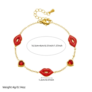 Detail of gold chain bracelet with red lip pendant and heart zircon showing 16.5cm length