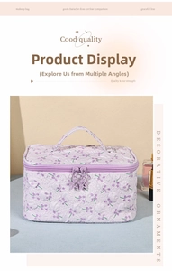Detailed texture of purple floral makeup bag with star-shaped zippers and sturdy top handle