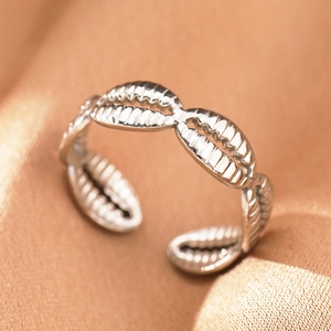 Detailed close-up of bohemian silver seashell ring with adjustable opening design