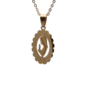 Detailed view of oval gold hollowed-out pendant featuring a praying figure silhouette