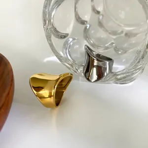 Minimalist chunky irregular curved stainless steel rings in gold and silver finish