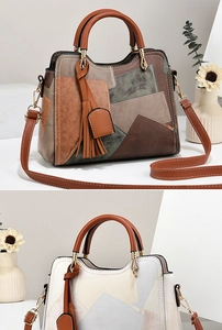 Detail of color-block geometric pattern on PU leather handbag with tassel charm