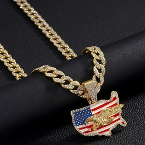 Close-up of hip hop USA map pendant with eagle on iced-out Cuban chain necklace
