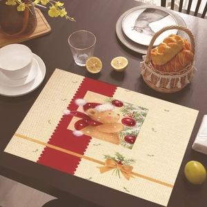 Detailed woven texture of Christmas table mat featuring bear and snowman holiday patterns