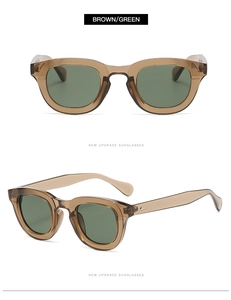 Detail view of brown transparent frames with green lenses and silver diamond rivets