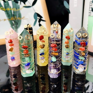 Set of eight colorful crystal pillars wrapped in gold wire with small gemstone accents