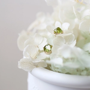 925 silver olivine stud earrings with gold plating on white hydrangea flowers