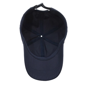 Interior view of breathable navy baseball cap with reinforced seams and adjustable strap