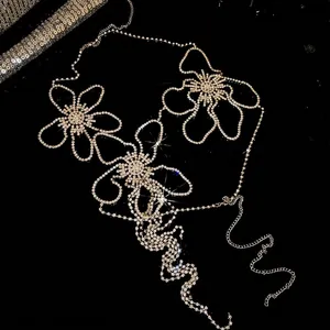 Elegant silver body chain with sparkling rhinestone flower charms for evening wear and gala