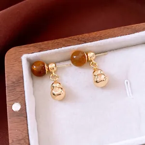 Retro calabash drop earrings with amber acrylic beads and gold plating in a wood box