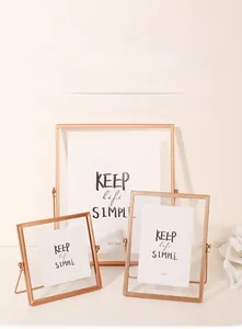 Detail view of rose gold metal frames in 4x6 and 8x10 sizes with double-sided glass