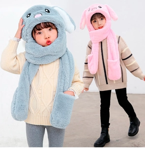 Detail view of plush 3-in-1 rabbit ear hat scarf and gloves set for kids in blue and pink