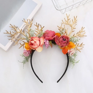 Floral deer antler headband with pink and red velvet roses for festive hair styling