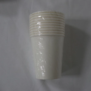 Close-up of stacked white disposable paper cups in transparent plastic film packaging