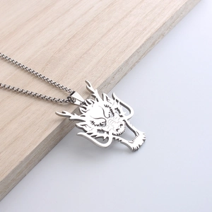 Silver wolf head dragon pendant necklace on wood surface for men in hip hop style