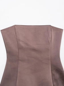 Detail of silk satin fabric texture on dark brown strapless top with fine sewing lines