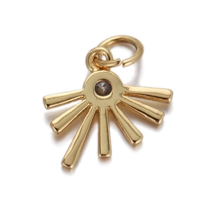 Detailed view of a gold-plated sunburst charm with a central dark zircon inlay