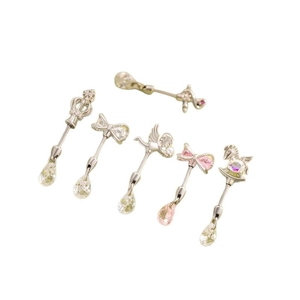 Titanium steel bow and carousel cartilage earrings with sparkling zircons set in silver
