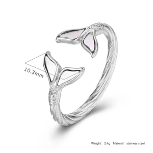 Detailed macro of stainless steel fishtail ring with shell inlay and spiral texture