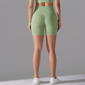 Detail of high waist seamless light green yoga shorts with scrunch butt lift effect