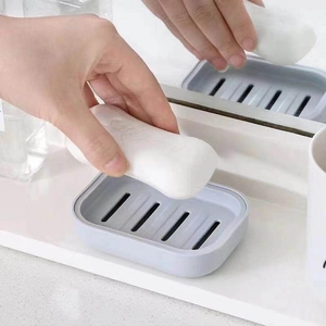 Detail showing the drainage holes of the light blue soap box for a dry bathroom counter