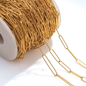 Golden stainless steel paperclip chain on white spool for DIY jewelry making and crafts