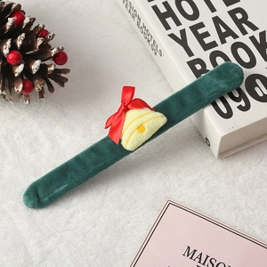 Green velvet Christmas slap bracelet with plush yellow bell and red ribbon bow