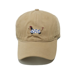 Detail of dachshund embroidery on a khaki cotton baseball cap with reinforced visor stitching