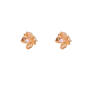 Vintage floral pearl stud earrings with golden textured petals and pink center pearls