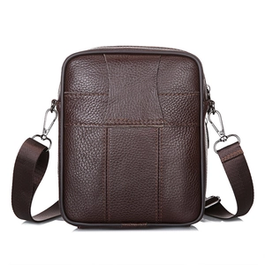 Dark brown leather shoulder bag for men with litchi texture and fabric strap on white background