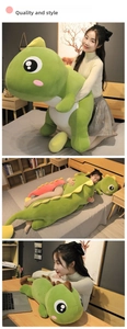 Green dinosaur plush body pillow used as a soft sleeping cushion in a cozy bedroom