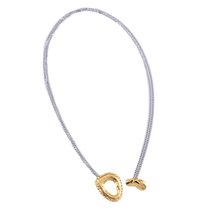 Two-tone mixed metal sweater necklace featuring irregular rock texture gold pendant