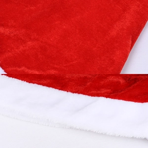 Detail of red velvet Christmas hat fabric with thick white faux fur plush border trim