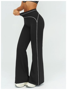 Detail of high-waist flared yoga pants showing high elasticity with white side stitching