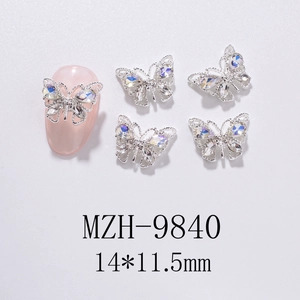 Detail of hollow silver butterfly nail art charms with sparkling AB rhinestones