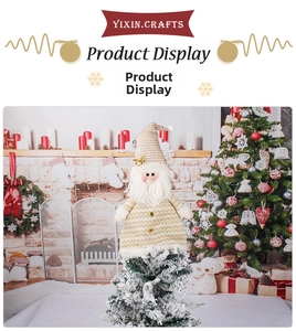 Detail of Santa Claus tree topper with white and gold knit fabric and sequins