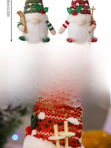 Detail of a 28cm glowing Christmas gnome with knitted striped hat and skiing sticks