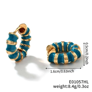 Detail view of vintage enamel hoop earrings with blue stripes and size measurements