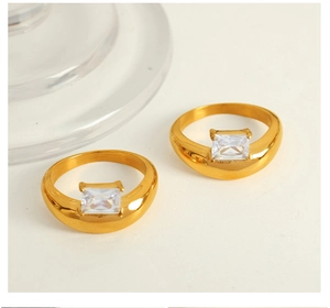 Detail of minimalist 18k gold plated ring featuring a square-cut sparkling zircon stone