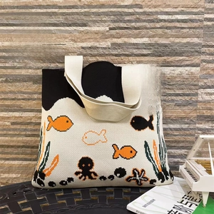 Detailed close-up of ocean-themed knitted tote bag featuring octopus and starfish patterns