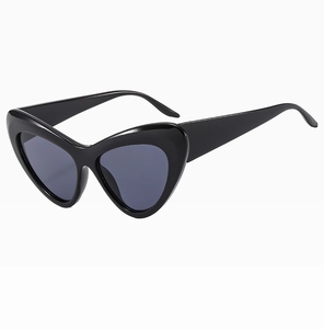 Side view of sleek black heart shaped cat eye sunglasses with dark UV400 lenses