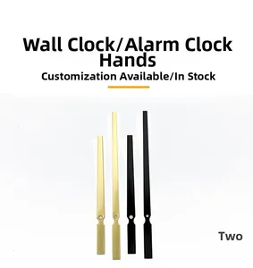 Close-up of replacement gold and black metal clock hands for quartz wall clock DIY repair