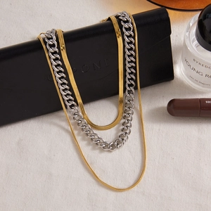 Three-layer layered necklace featuring gold snake chains and silver cuban link style
