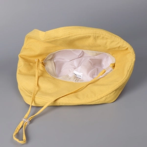 Foldable yellow cotton linen sun hat for women with UV protection and adjustable wind cord