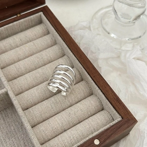 Minimalist S925 sterling silver multi-layer open ring displayed in a wooden jewelry box
