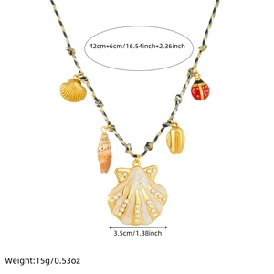Detailed view of woven rope necklace with gold shell and ladybug charms and measurements