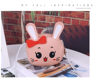 Detail of pink cartoon rabbit toddler crossbody bag with cute 3D bow and braided strap